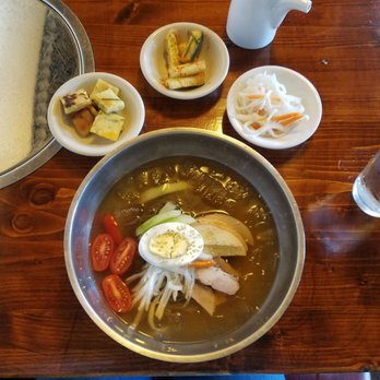 Korea Garden - Naengmyeon and banchan (pancake, cucumber side dish, and pickled radishe) this is a perfect dish for summer! - Korean Near Me - Omaha, Nebraska Korea Garden - Naengmyeon and banchan (pancake, cucumber side dish, and pickled radishe) this is a perfect dish for summer! - Korean Near Me - Omaha, Nebraska