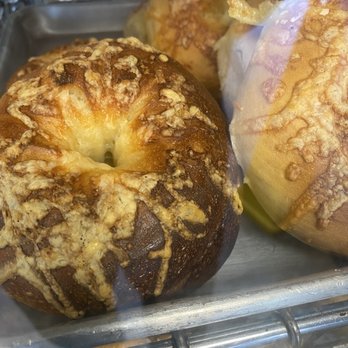 Hot Bagels Abroad - This what passes as an Asiago cheese bagel. The bagel is burned to oblivion. - Bagels Near Me - Bloomfield, New Jersey