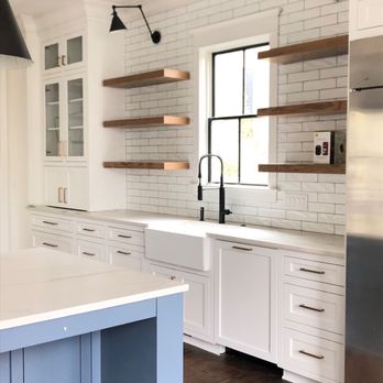Sullivan Custom Cabinets - a kitchen with a large island - General Contractors Near Me - N Charleston, South Carolina