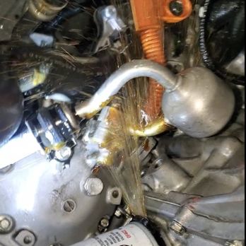 Jiffy Lube - Oil spewing from the filter after Jiffy Lube left on a double gasket!!  Ugh. - Auto Repair Near Me - San Diego, California