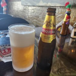 Piolin Restaurant Sr - CusQueña Golden Larger Peruvian beer.