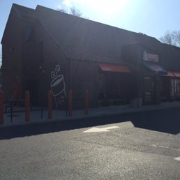  the outside of a dunkin donuts shop