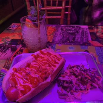 Forbidden Cove - Hawaiian dog and an empty Mai Tai - Tiki Bars Near Me - San Diego, California Forbidden Cove - Hawaiian dog and an empty Mai Tai - Tiki Bars Near Me - San Diego, California
