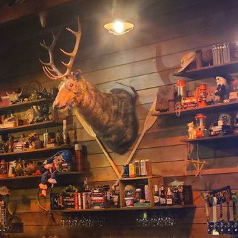 Slashers Axe Throwing & Ales - The incredibly decorated bar - there are 39 horror movie references on the shelves! - Axe Throwing Near Me - Costa Mesa, California Slashers Axe Throwing & Ales - The incredibly decorated bar - there are 39 horror movie references on the shelves! - Axe Throwing Near Me - Costa Mesa, California