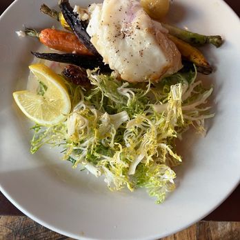 The Drunken Horse - Sea bass was really good. Root veggies and curly endive completed the palette. - Wine Bars Near Me - St. Augustine, Florida