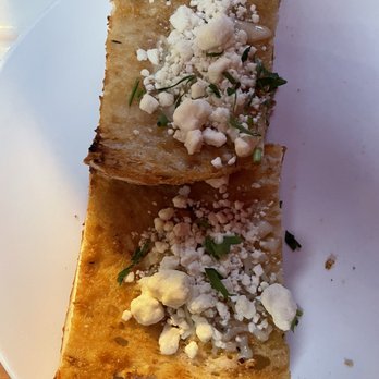 Pisticci - Roasted Garlic Bread with goat cheese (half gone) - Italian Near Me - New York, New York Pisticci - Roasted Garlic Bread with goat cheese (half gone) - Italian Near Me - New York, New York