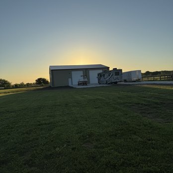 New Perspective Construction - Outside view. Left the motorhome outside while the concrete pad/apron were curing. - Patio Coverings Near Me - Godley, Texas