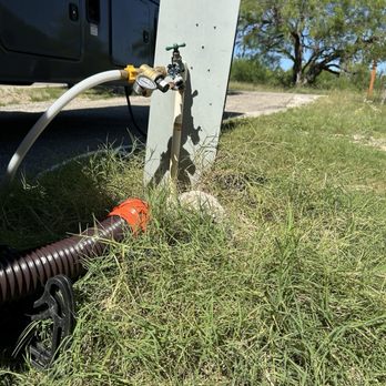 Garner State Park - Tall grass around electrical and faucet, #152 - Parks Near Me - Concan, Texas