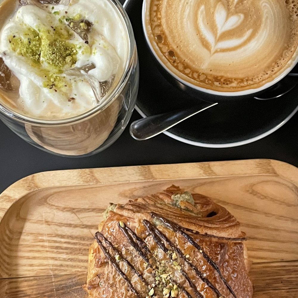 Cafe 295 - Iced pistachio latte, hot latte and chocolate pistachio croissant - Cafes Near Me - Toronto, Ontario Cafe 295 - Iced pistachio latte, hot latte and chocolate pistachio croissant - Cafes Near Me - Toronto, Ontario