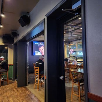 Who’s on Layton | A Cream City Concepts Destination - a man sitting at a table in a restaurant - Sports Bars Near Me - Milwaukee, Wisconsin Who’s on Layton | A Cream City Concepts Destination - a man sitting at a table in a restaurant - Sports Bars Near Me - Milwaukee, Wisconsin