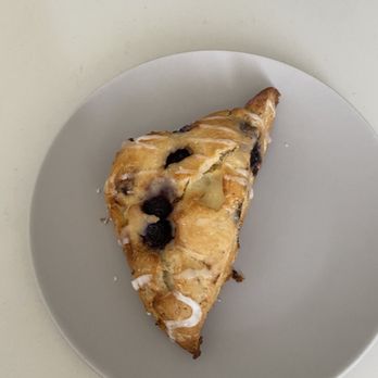 Blacksmith Bakery - a blueberry scone on a white plate - Bakeries Near Me - Maple Ridge, British Columbia Blacksmith Bakery - a blueberry scone on a white plate - Bakeries Near Me - Maple Ridge, British Columbia