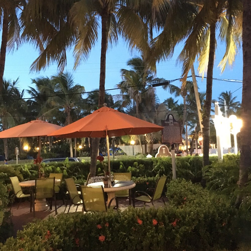 Southernmost Point Guest House - Brunch dining area at sunset. Nice area to hang out while waiting... - Bed & Breakfast Near Me - Key West, Florida Southernmost Point Guest House - Brunch dining area at sunset. Nice area to hang out while waiting... - Bed & Breakfast Near Me - Key West, Florida