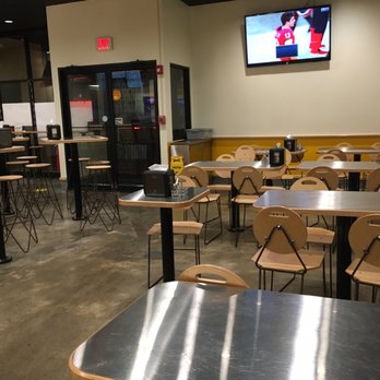 Halal Grub - tables and chairs in a restaurant - Kebab Near Me - Albany, New York Halal Grub - tables and chairs in a restaurant - Kebab Near Me - Albany, New York