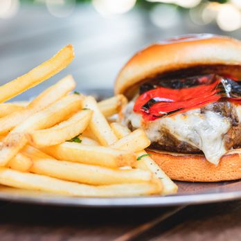 Eureka! - a burger and french fries on a plate - American Near Me - Clovis, California