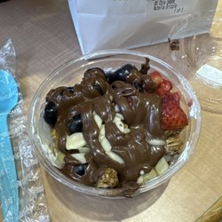 Tropical Smoothie Cafe - Yogurt, fruit, drizzle of honey along with drizzle of nutella and almonds on top