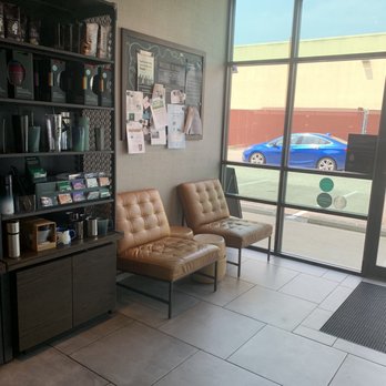 Starbucks - a coffee shop with two chairs and a bookcase - Coffee & Tea Near Me - Indianapolis, Indiana
