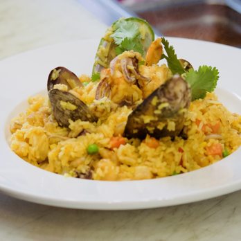 La Ronda Restaurant - Arroz Con Marisco is a plate with clams, mussels, shrimp and calamari. - Peruvian Near Me - San Mateo, California La Ronda Restaurant - Arroz Con Marisco is a plate with clams, mussels, shrimp and calamari. - Peruvian Near Me - San Mateo, California