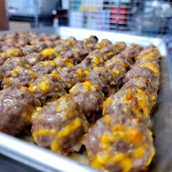 The Northern Nomad - Ok. So we hand rolled our juicy beer brat and cheddar mix, now we batter and fry them for your own personal enjoyment!