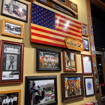 Mission BBQ - a wall full of american flags and memorabilia - Barbeque Near Me - Hampton, Virginia Mission BBQ - a wall full of american flags and memorabilia - Barbeque Near Me - Hampton, Virginia