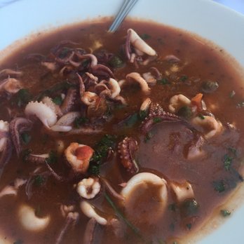 La Rustica - Calamari in tomato sauce - Italian Near Me - Seattle, Washington La Rustica - Calamari in tomato sauce - Italian Near Me - Seattle, Washington