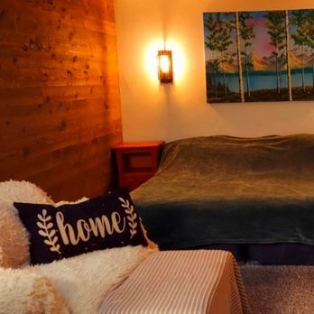 Winston Renovations - Custom interior installs, this is a pine wall we installed and wall sconces to create a cabin feel. - Handyman Near Me