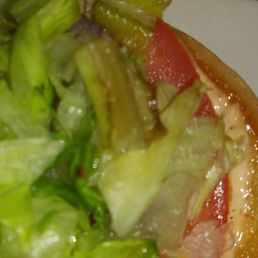 Slimmy brown lettuce on a stale hamburger i ordered today