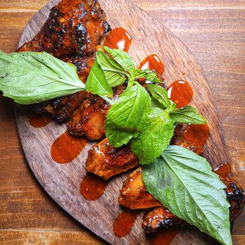 Pizzette - a plate of food on a wooden table - Pizza Near Me - Miami Beach, Florida