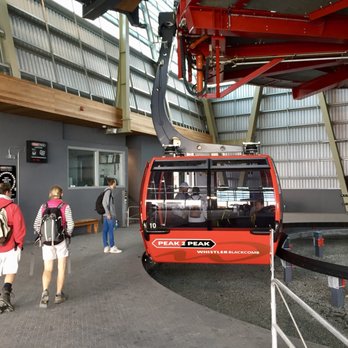 Peak 2 Peak Gondola - Boarding a Gondola Car - Peak 2 Peak Gondola - Transportation Near Me - Whistler, British Columbia Peak 2 Peak Gondola - Boarding a Gondola Car - Peak 2 Peak Gondola - Transportation Near Me - Whistler, British Columbia