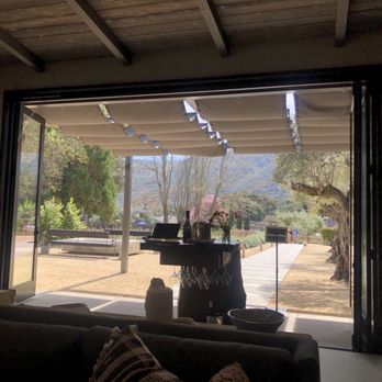 Pelio Estate Wines - Looking out into the courtyard - Wineries Near Me - Carmel Valley, California Pelio Estate Wines - Looking out into the courtyard - Wineries Near Me - Carmel Valley, California