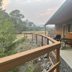 Cody Lodging Company - View from Cabin 2 to the grill and fire pit