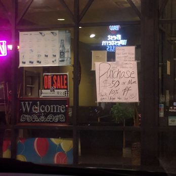Narita - The front of the restaurant... Normally not a good sign when you have to hang these many signs... - Sushi Bars Near Me - Plainfield, Indiana