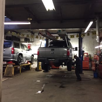 Peabody Alignment & Brake - A photo of there nice shop and Chris doing a excellent job on my brakes on my Ford F-250..very happy with their service - Auto Repair Near Me - Peabody, Massachusetts