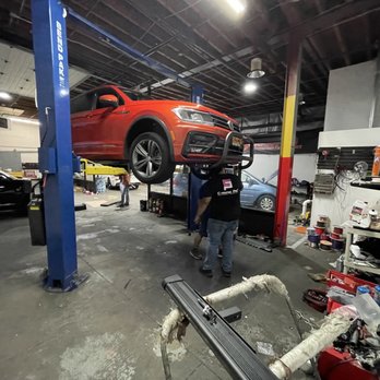 Idea First Motorsport  - Eddie Hernandez, the Store Manager of Idea First Automotive, Inc. and crew installing Front and Rear bumper guards. - Auto Customization Near Me - New Hyde Park, New York
