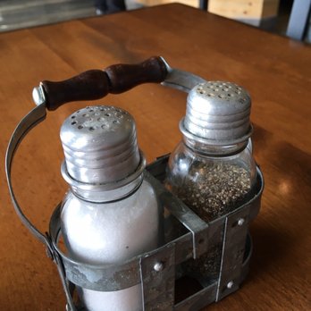 Greek Express - two salt and pepper shakers in a basket - Mediterranean Near Me - Bellevue, Washington
