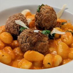 Gnocchi with vodka sauce and meatballs added