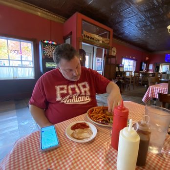 Backwoods Bar & Grill - a man eating a meal - Bars Near Me - McGregor, Iowa