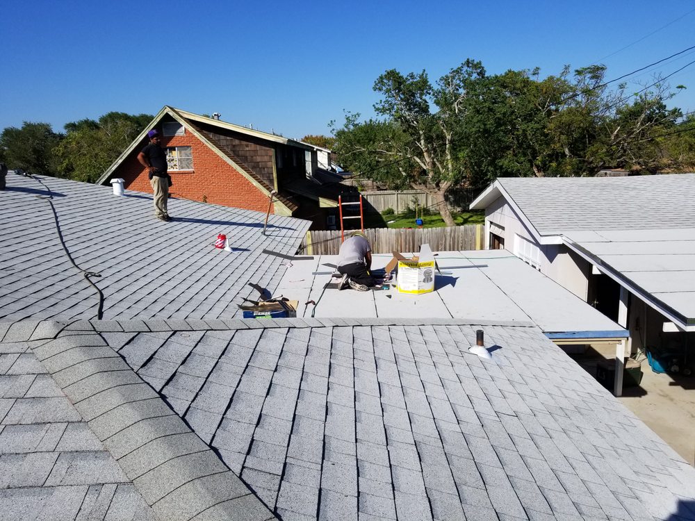 Slide of Vela's Roofing and Construction