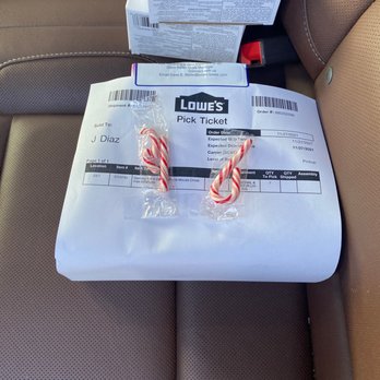 Lowe's Home Improvement - Picking up my items from a locker, and I got treated with candy canes taped onto my receipt. - Hardware Stores Near Me - Vallejo, California