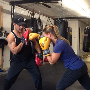 Luyando Boxing - Coach training one of his boxers. - Boxing Near Me - Champaign, Illinois