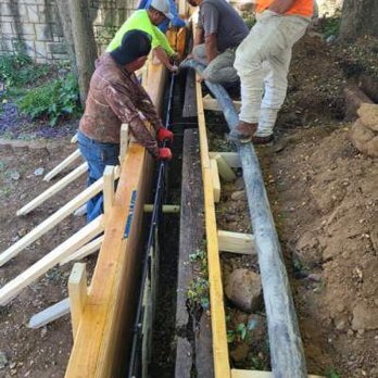 E & B Foundation Repair & Roofing - Pouring of concrete in the retaining wall - Roofing Near Me