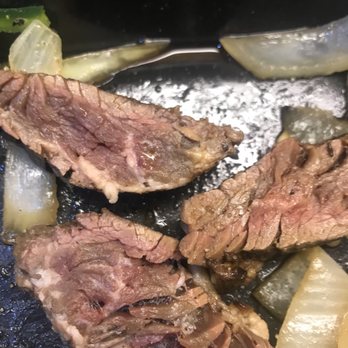 Uncle Julio's - Meat is RAW. Disgusting- you can see the fat has not even cooked on the bottom piece. - Mexican Near Me - Grapevine, Texas Uncle Julio's - Meat is RAW. Disgusting- you can see the fat has not even cooked on the bottom piece. - Mexican Near Me - Grapevine, Texas