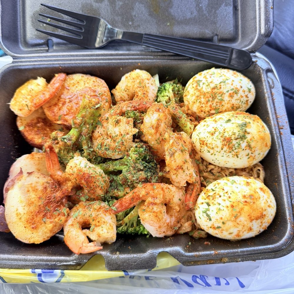Crab & Cluck - Shrimp noodle plate with garlic butter sauce. Added garlic eggs. Corn substituted for extra potatoes - Seafood Near Me - Decatur, Georgia