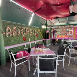 Arigato Bubble Bar & Coffee - The seating area with games on each table