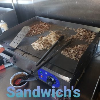 Puerto Rican Cravings - an image of a grill with food on it - Food Trucks Near Me - Ocala, Florida Puerto Rican Cravings - an image of a grill with food on it - Food Trucks Near Me - Ocala, Florida