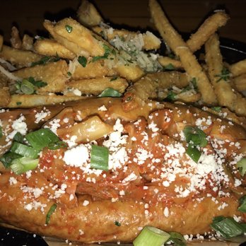 The Good Bar and Eatery - Kimchi Dog with Garlic Parm Fries- surprisingly good! The sausage is impressive & fries are addictive!!! - Music Venues Near Me - Long Beach, California