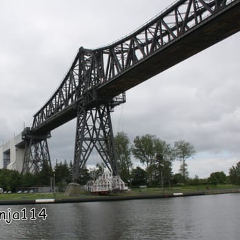 Schwebefähre - Die Rendsburger Hochbrücke mit Schwebefähre, oben überquert die Eisenbahn den NOK - Landmarks & Historical Buildings Near Me - Rendsburg, SH Schwebefähre - Die Rendsburger Hochbrücke mit Schwebefähre, oben überquert die Eisenbahn den NOK - Landmarks & Historical Buildings Near Me - Rendsburg, SH