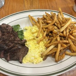 Steak and eggs with Herb french fries Steak and eggs with Herb french fries