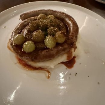 Yolan - Fennel sausage with blistered grapes served over whipped potatoes - Italian Near Me - Nashville, Tennessee Yolan - Fennel sausage with blistered grapes served over whipped potatoes - Italian Near Me - Nashville, Tennessee