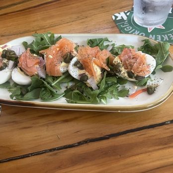 Clear Sky Draught Haus - Deviled Eggs w/ salmon, capers and onions on a bed of arugula. Oh, and 1 carrot. - Gastropubs Near Me - Dunedin, Florida Clear Sky Draught Haus - Deviled Eggs w/ salmon, capers and onions on a bed of arugula. Oh, and 1 carrot. - Gastropubs Near Me - Dunedin, Florida