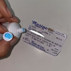 Marino Pharmacy - Safety seal removed from tube.